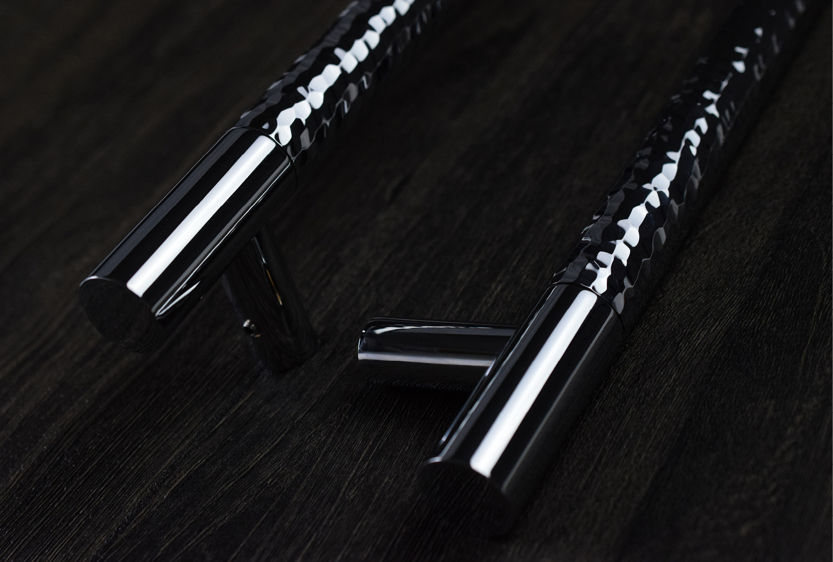 Image of two luxury, custom solid hammered barrel pull handle. The grip is hand hammered by Turnstyle Designs.