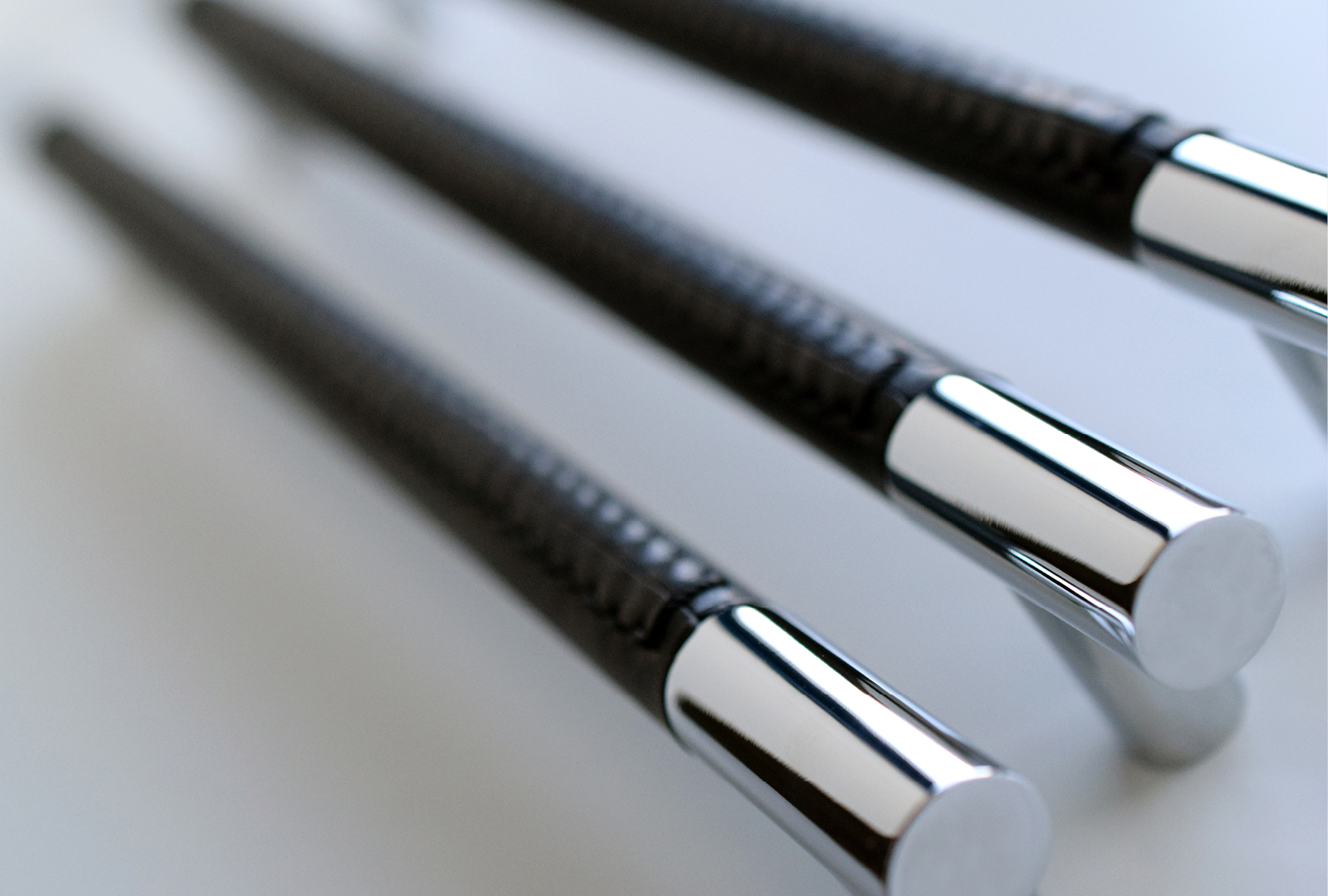 Enlarged image of the large barrel stitch out recess leather. Grip covered in black recess leather. Hand stitched by Turnstyle Designs.