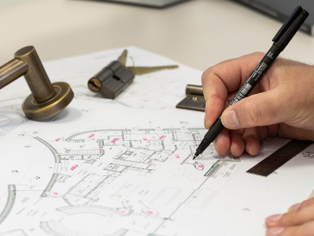 Drawings for a large scale residential project are being mapped out for hardware and ironmongery by an expert from Turnstyle Designs.